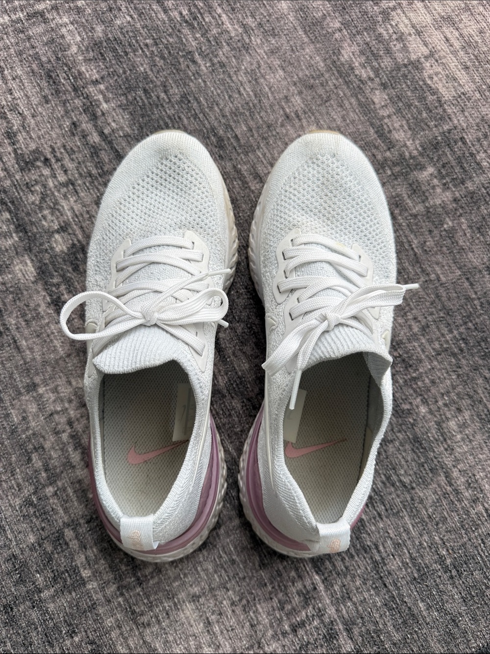 Nike Women’s White Knit Sneakers with Pink Heel Detail